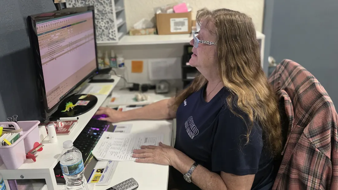Kathy at her desk at Oviedo Car Care, working through parts orders on screen